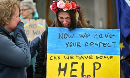 Members of the public show their support for Ukraine outside the Scottish parliament, Edinburgh, 3 March 2022.