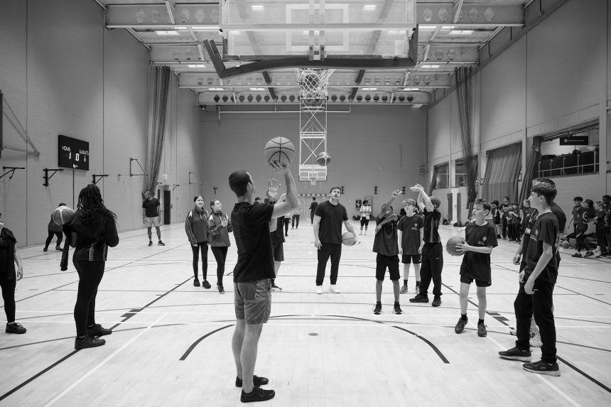 Image of pupils enjoying a session of basketball with the Oxford Blues team as part of the Oxford Sport Leaders Programme.