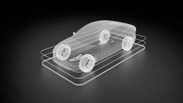 A futuristic wireframe of a vehicle on a charging pad.